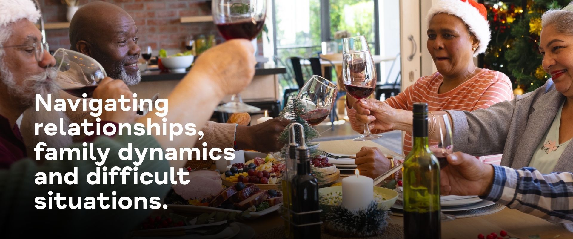 Happy diverse group of senior friends toasting at Christmas dinner in a warm dining room at home