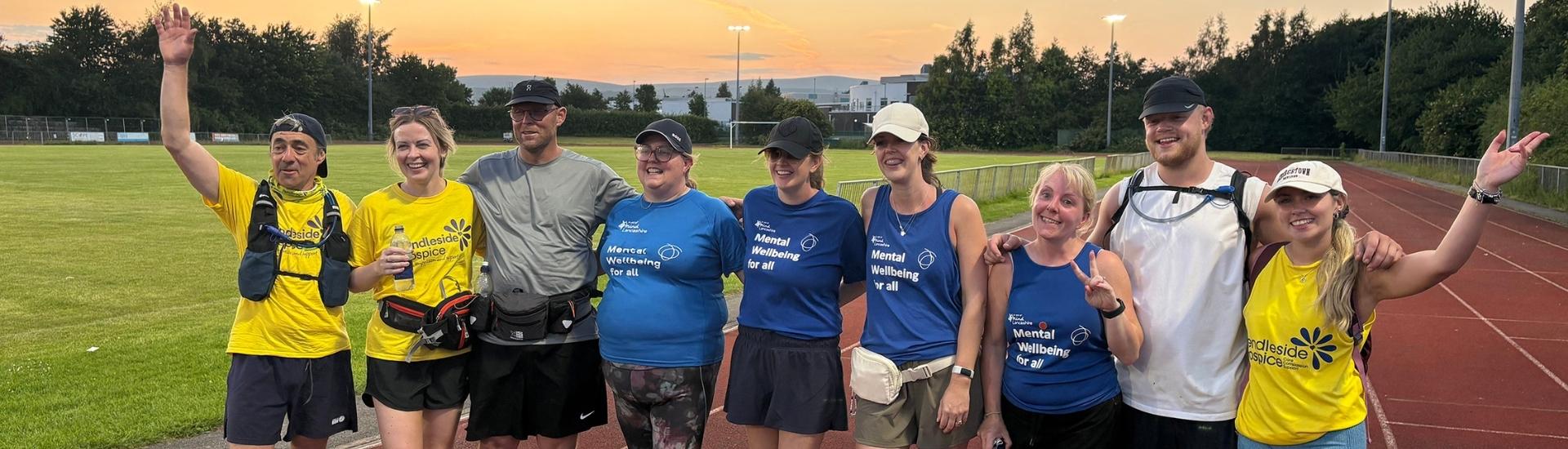 Summer solstice walking challenge - 17 hours after starting the walk, the group taking part are now finished at sunset